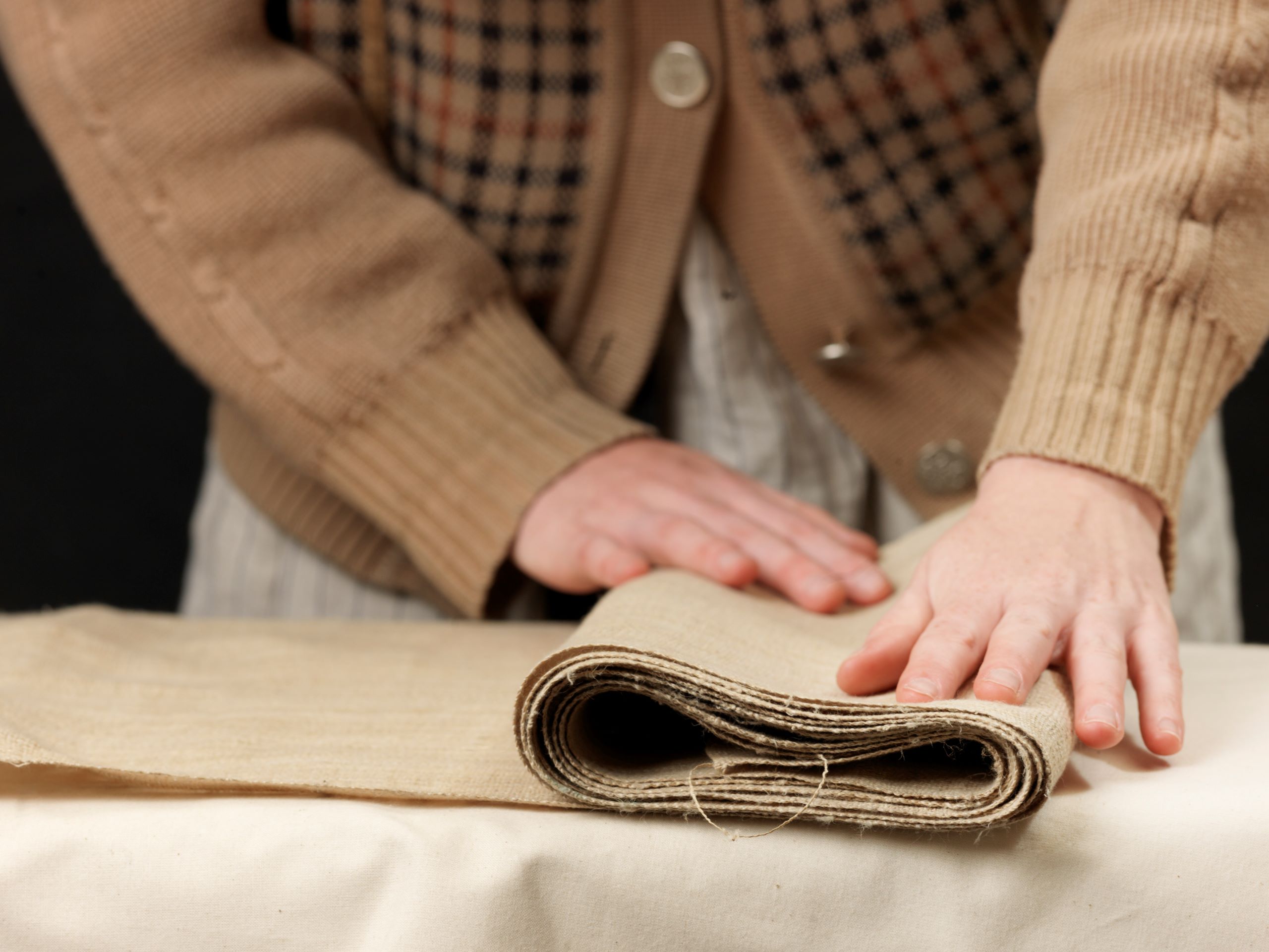 A History of Linen 10 cropped close up of young female designer s hands 2025 04 03 05 48 25 utc