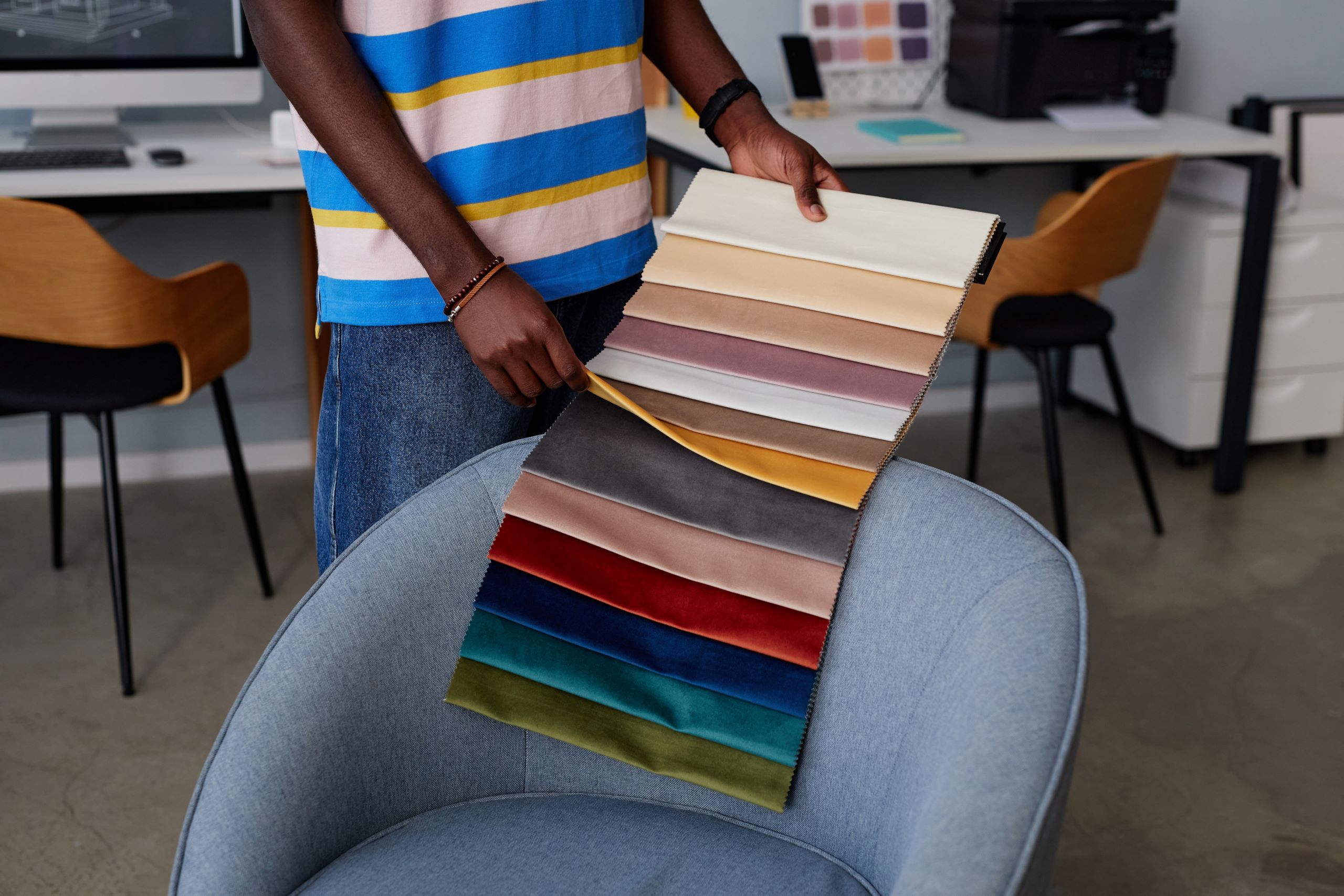 Introducing Dura-colour! 7 designer examining samples of textile 2025 03 09 23 44 20 utc