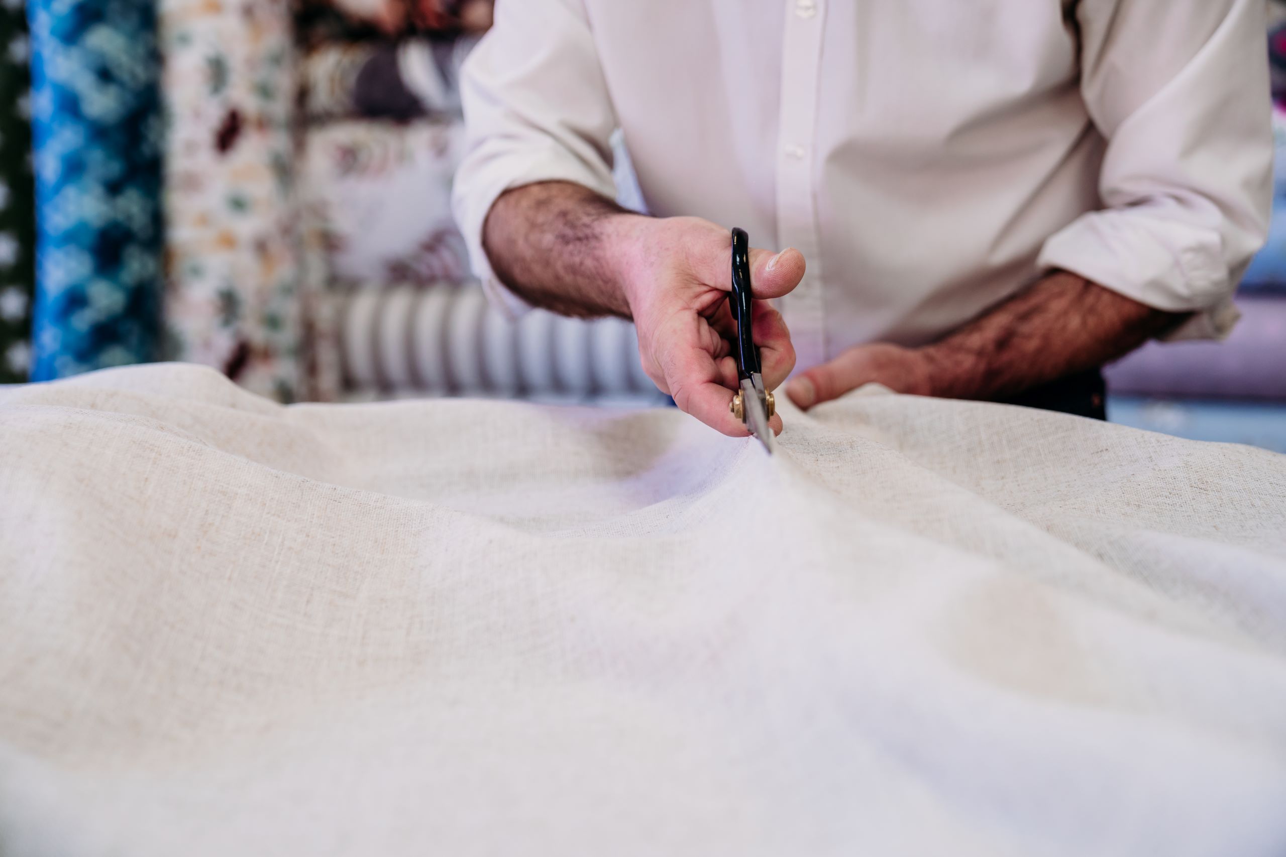 Fabric Know How 10 senior man working in atelier cutting curtains sm 2024 11 02 23 44 36 utc