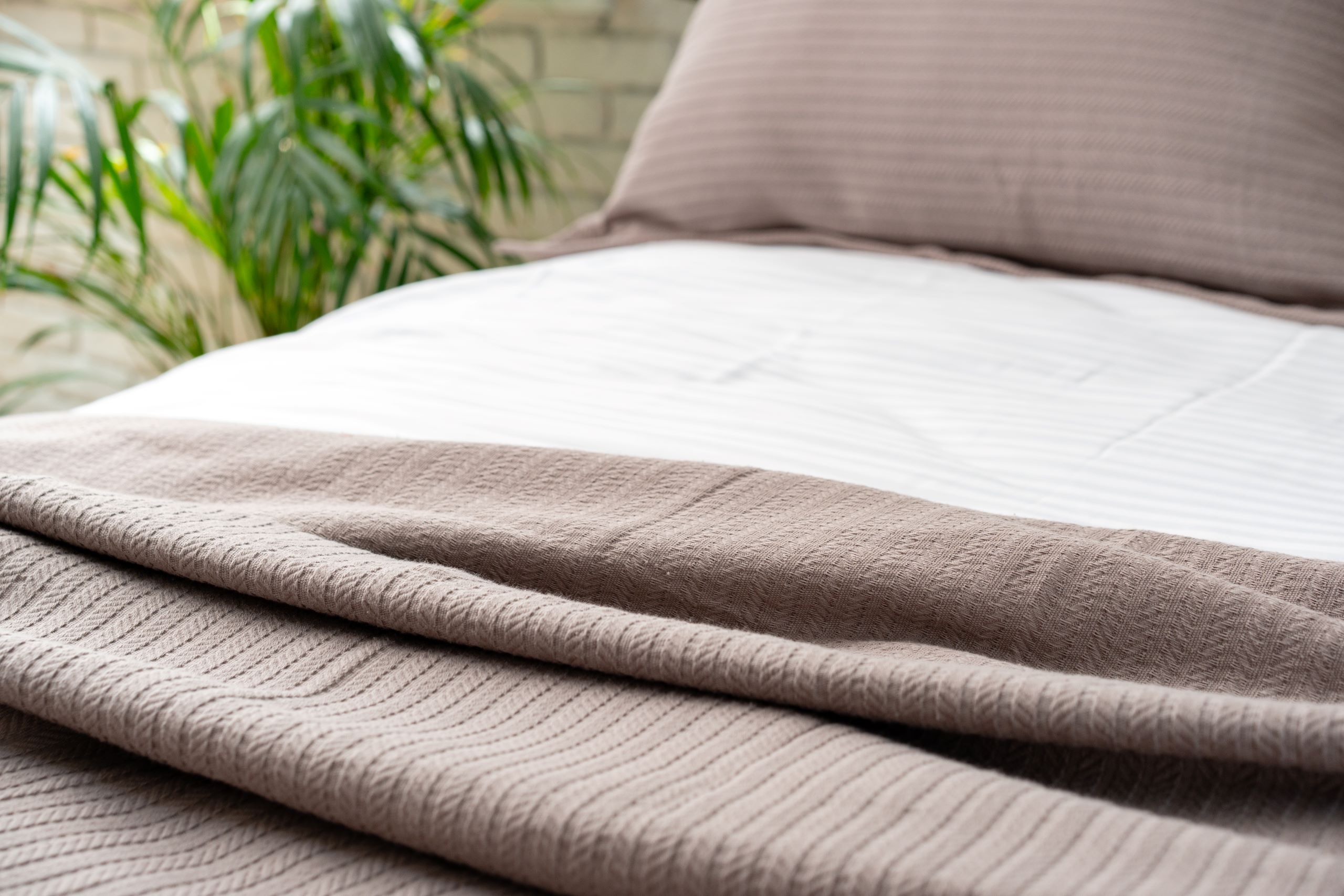 Traditional Redefined 9 soft brown knit blanket on a made bed 2025 02 25 04 09 20 utc
